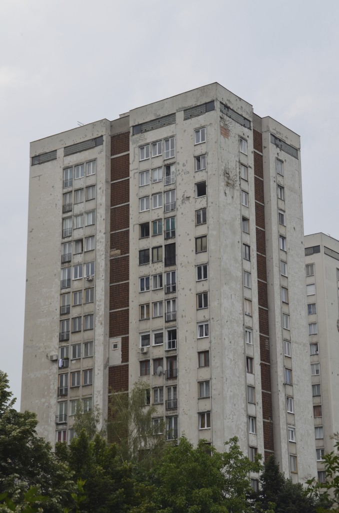 Bullet riddled Communist style apartment building